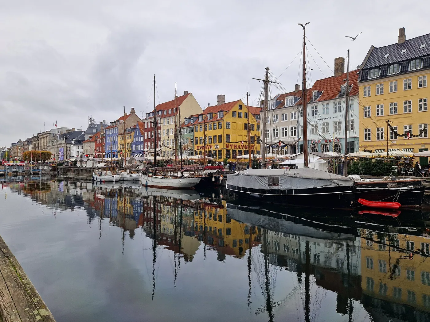 Colourful buildings and boats along Nyhavn in Copenhagen, Denmark