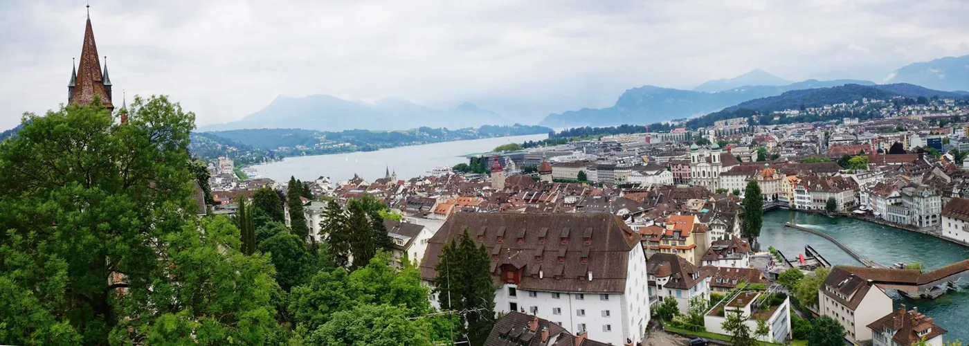 Rooftops of Lucerne beside its lake and surrounding mountains in Switzerland